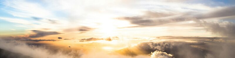 clouds above mountains during golden hour