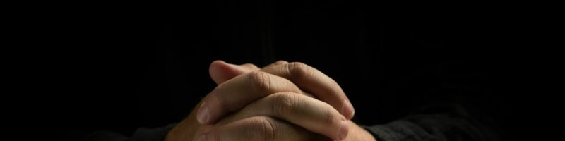 a person's hands on a book